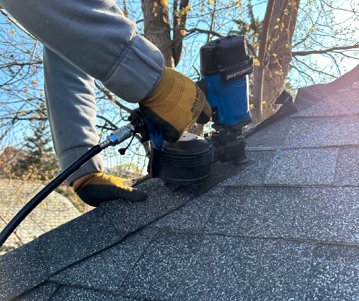 Square Roofing technician working on a residential roof